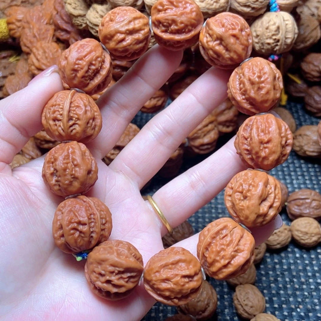 桃核吊坠红皮粗筋手串