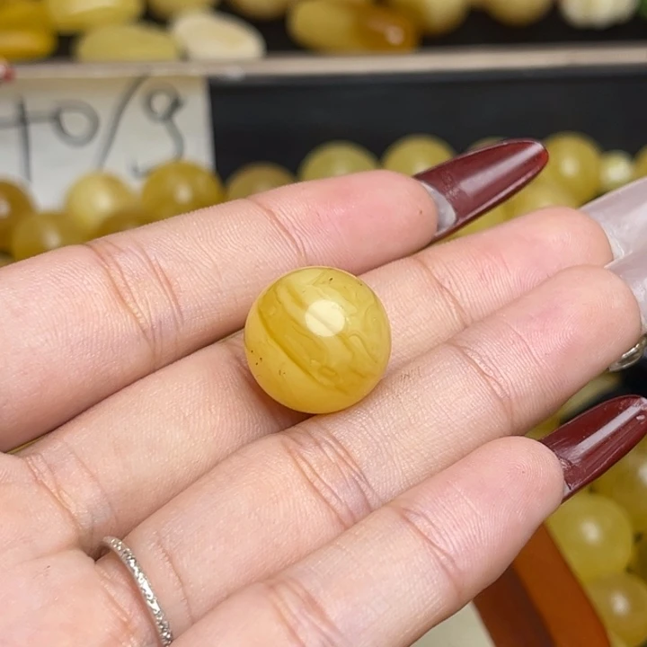 蟑***霸蜜蜡未镶嵌珠宝奇石鸡油黄满蜡妖花圆珠微瑕