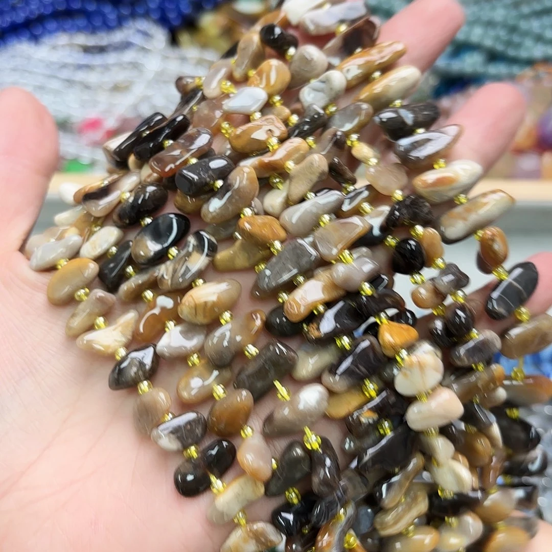 玛瑙/玉髓未镶嵌珠宝半成品黑奥宝中孔牙一条