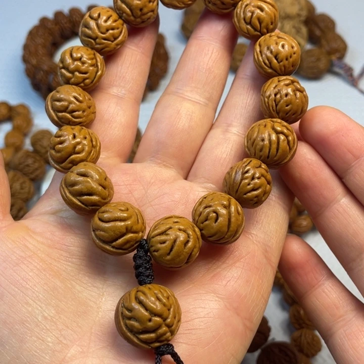 5号链接桃核手串一个