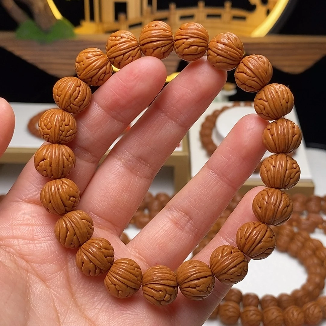 我****手串桃核12mm野生金麒麟桃核手串