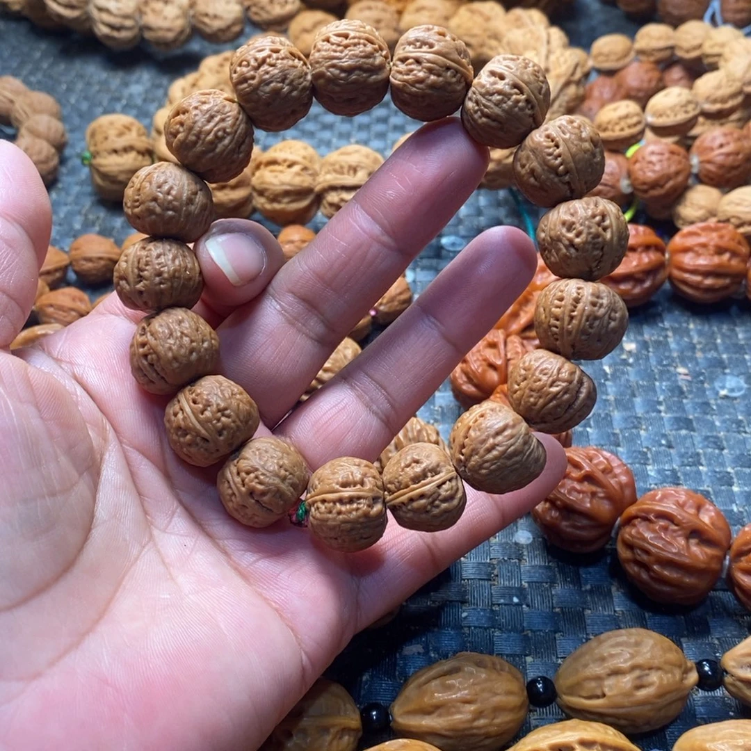 李***.文玩核桃吊坠磨盘