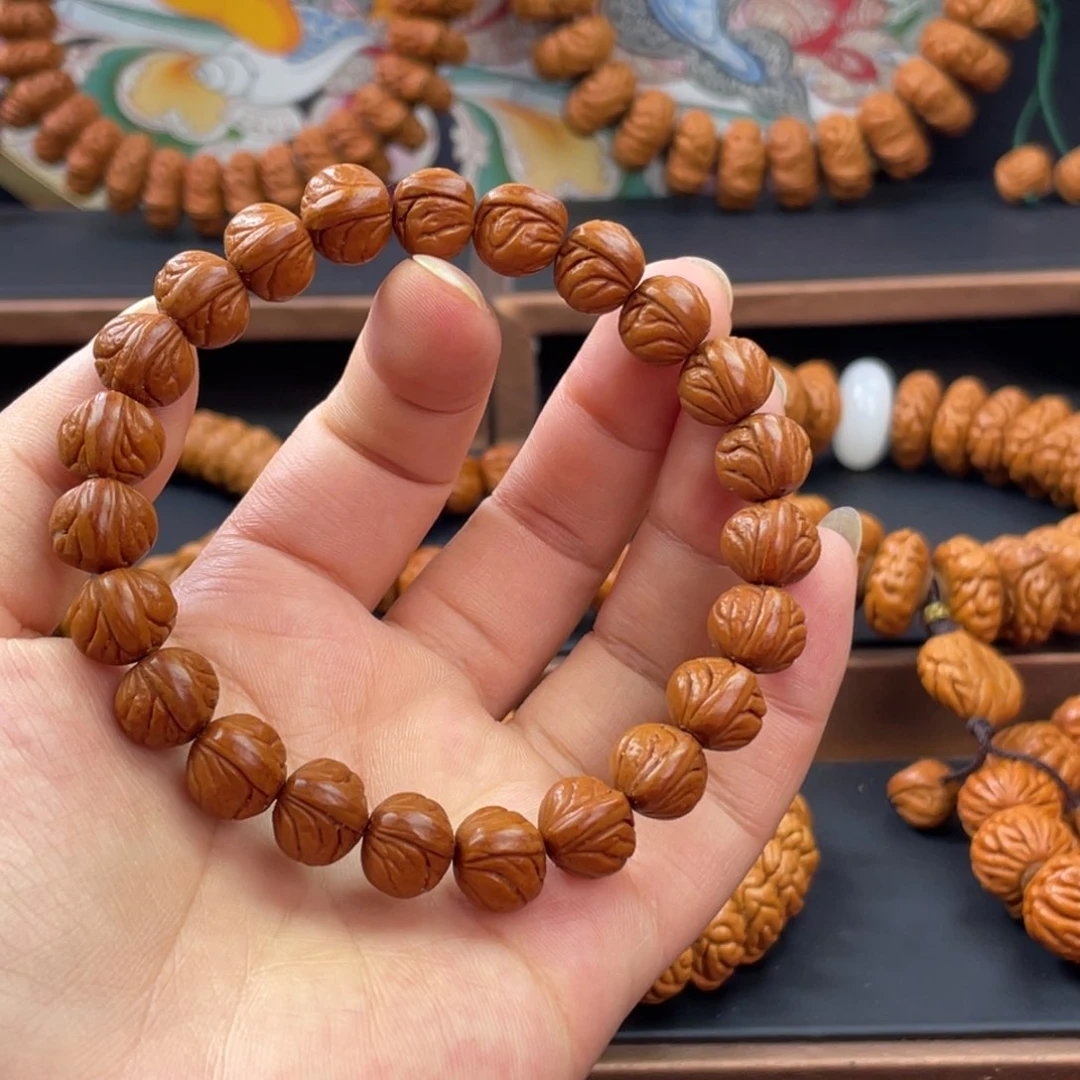 S***以桃核手串龙纹桃核玉龙脊