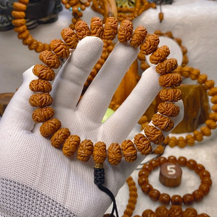 桃核吊坠小****）树王纽扣金蟾籽手持