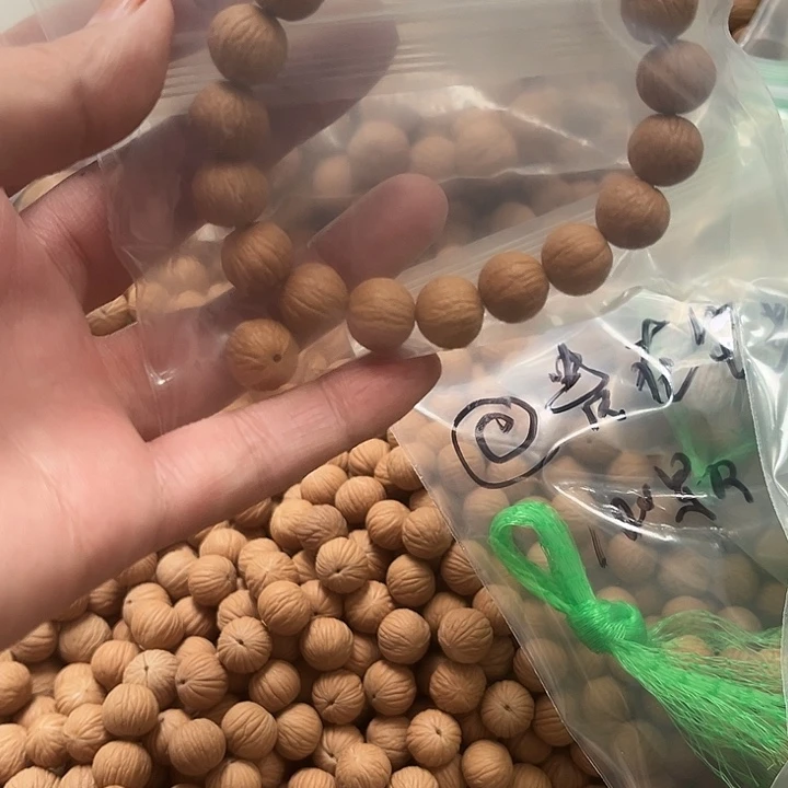 晴***哈手串猴头核桃凤羽精卡100颗