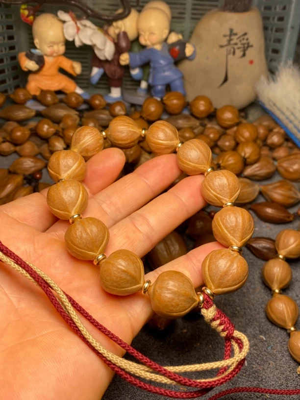 橄榄核正圆原皮手持短圆铁核手串