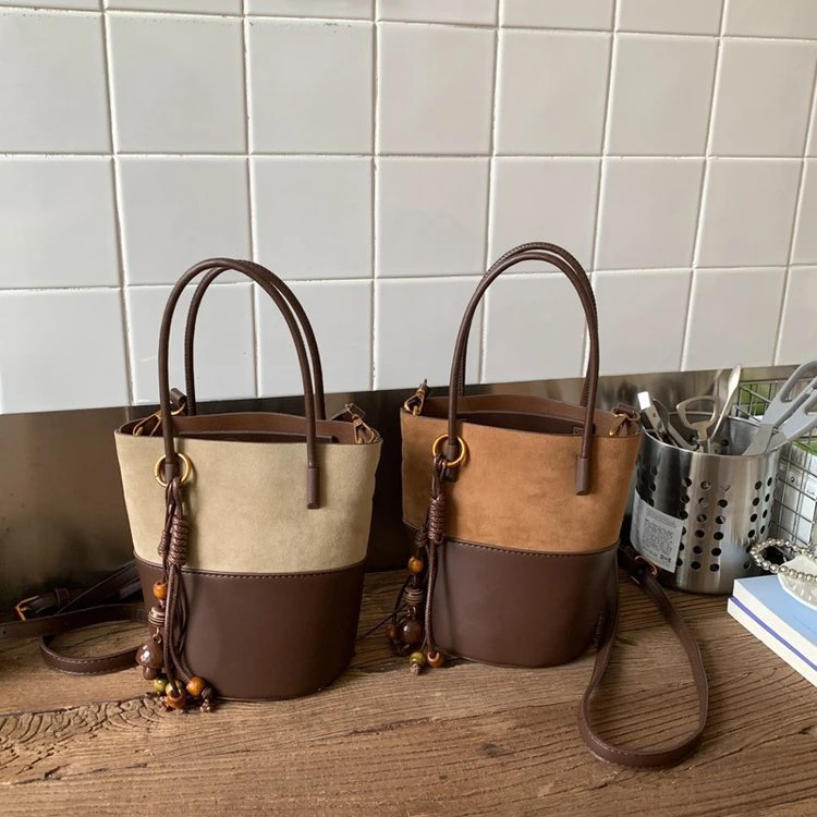 麂皮绒双拼撞色拉链水桶包女新款韩版时尚百搭斜挎包手提包2900