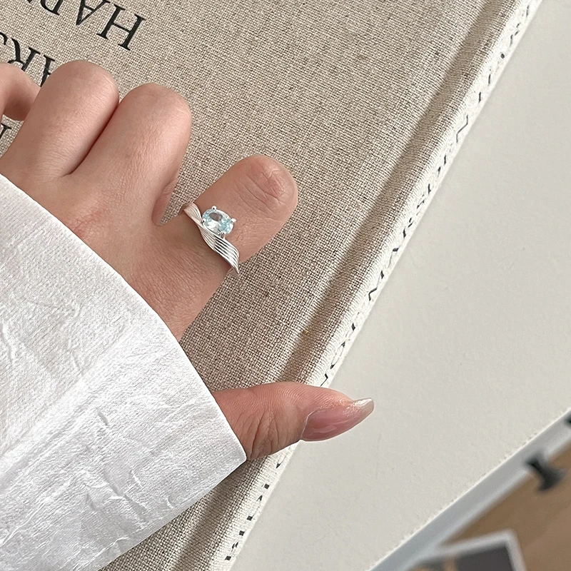 925银锆石戒指 925纯银蓝色锆石戒指女几何波浪个性时髦开口设计