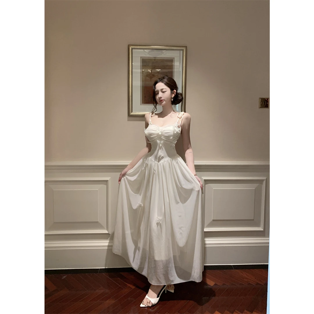 超仙法式性感立体蝴蝶吊带连衣裙高腰宽松大摆显瘦长款A字小白裙