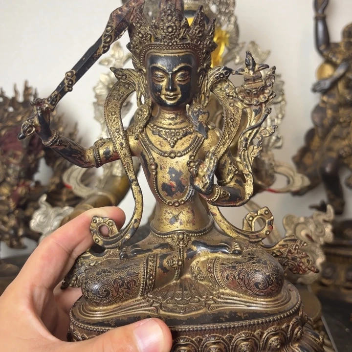 一***木举剑文殊黄铜摆件