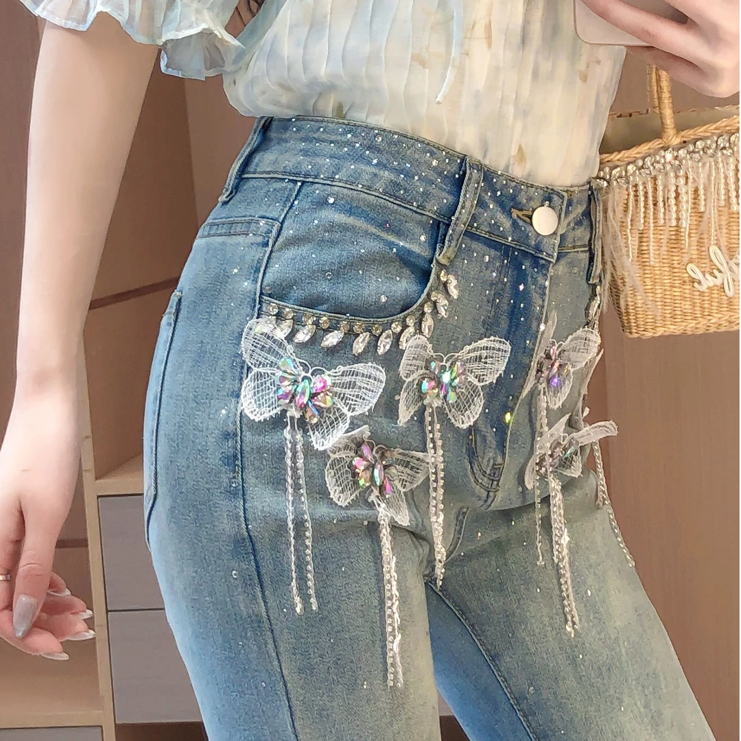 艾日秀春夏新款洋气时尚减龄烫钻立体蝴蝶高腰修身牛仔裤女F0292