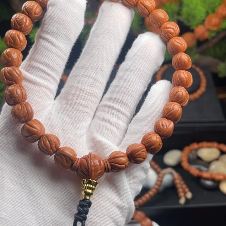 羿***邱吊坠桃核玉龙脊手持