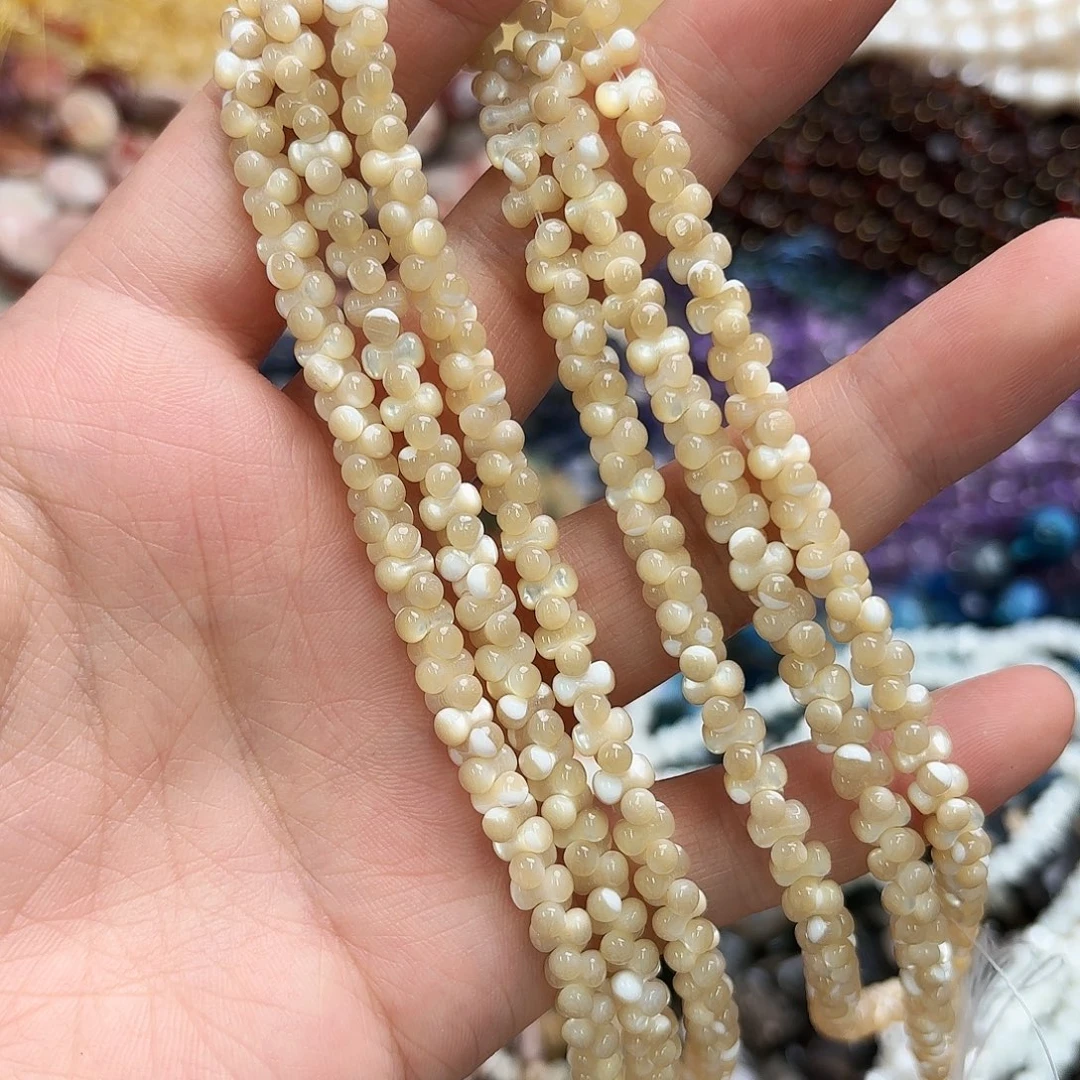 玛瑙/玉髓未镶嵌珠宝半成品3×6马蹄螺骨头一条咖