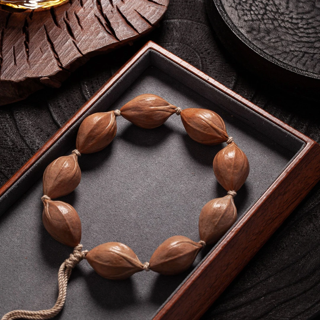 【今儿个高兴】原皮四花橄榄核 尺寸20左右