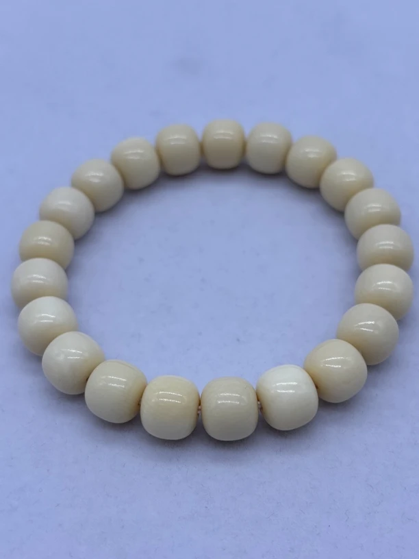 A062 猛犸牙约10*9老型珠牙芯料手串随机一条（图片仅部分）