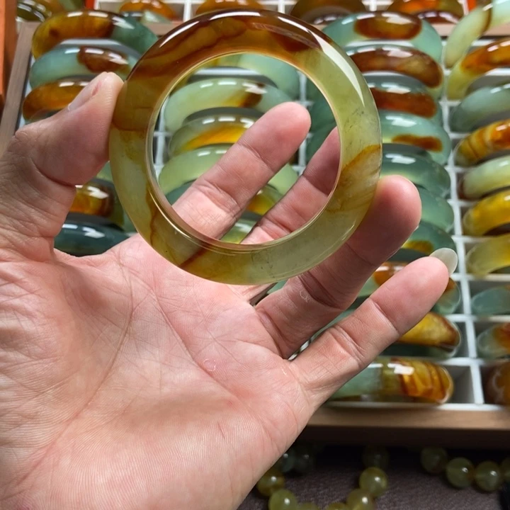 顾***卷未镶嵌蛇纹石玉手镯手串戒指吊坠