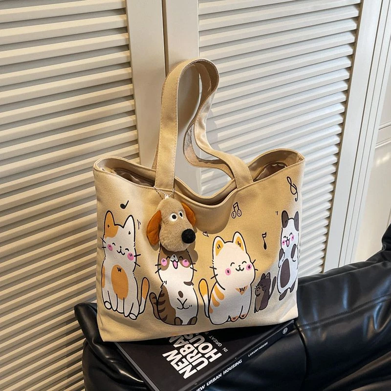 卡通猫咪帆布包包2025新款通勤托特大包大容量旅行通勤单肩手提袋