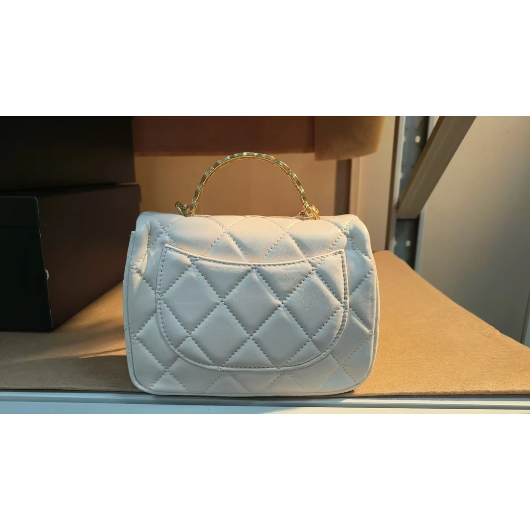 TOLEX2025新款手工时尚手提百搭真皮女包肥重工椭圆手柄白色20cm