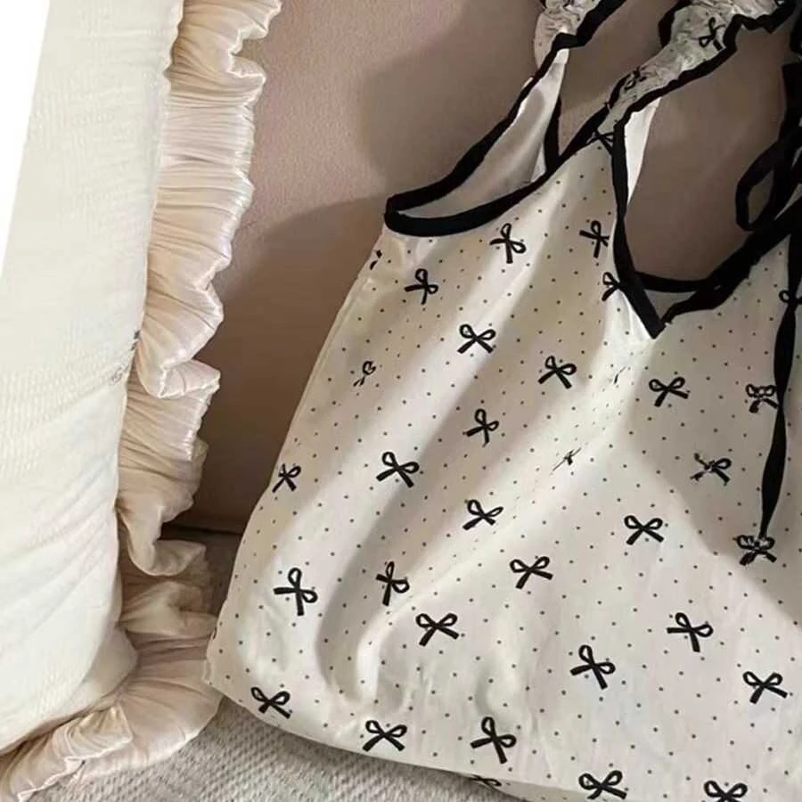 韩国小众蝴蝶结波点帆布包甜美少女抽绳褶皱手提包学生通勤单肩包