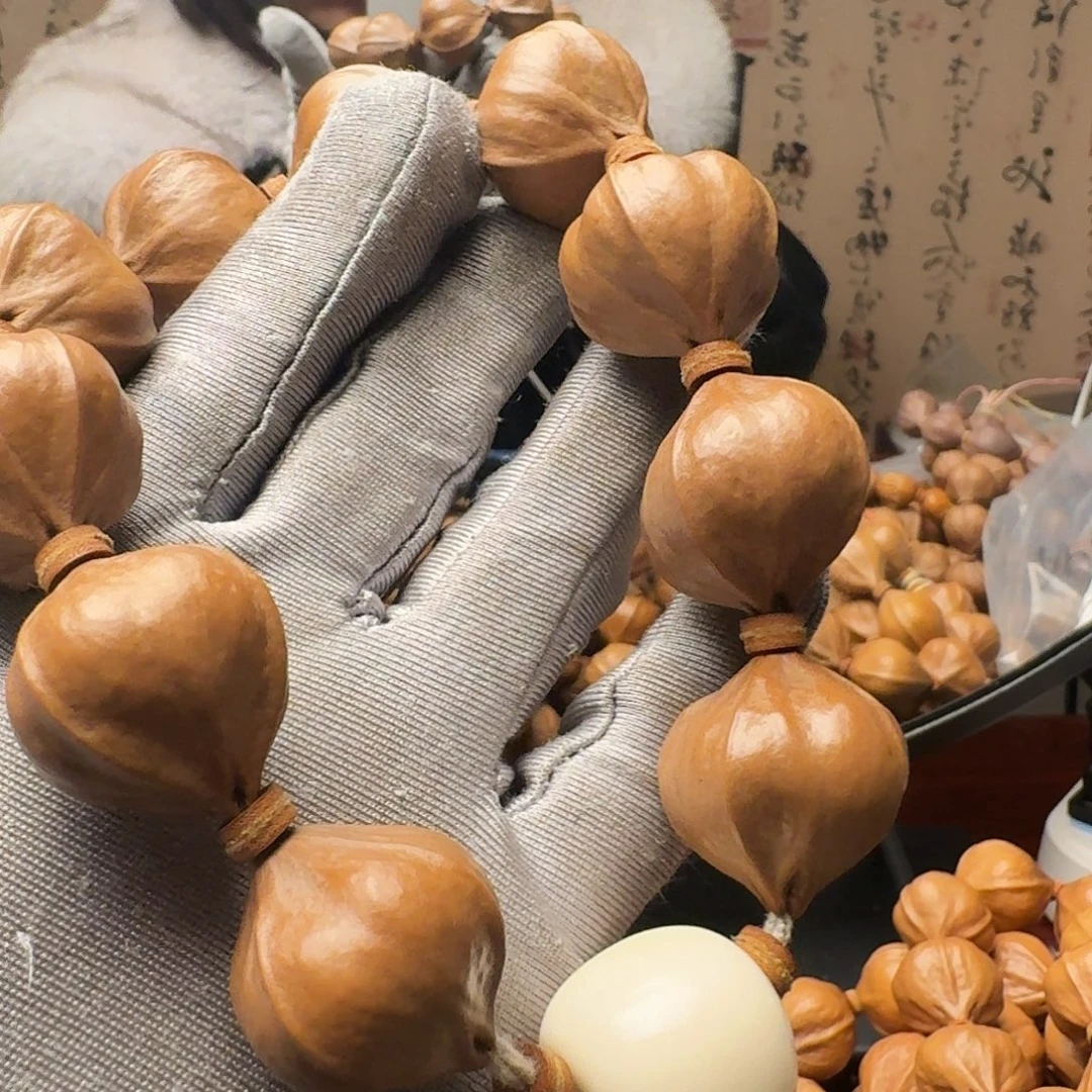 菲***扰橄榄核把件四花精品