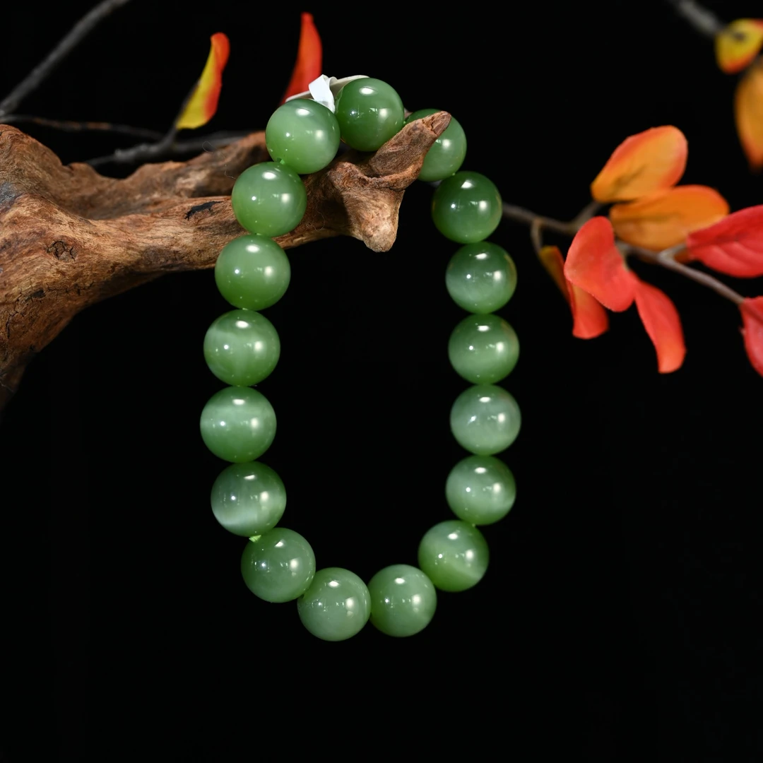 Lot8822 25YU108129和田玉碧玉猫眼手串/匡时