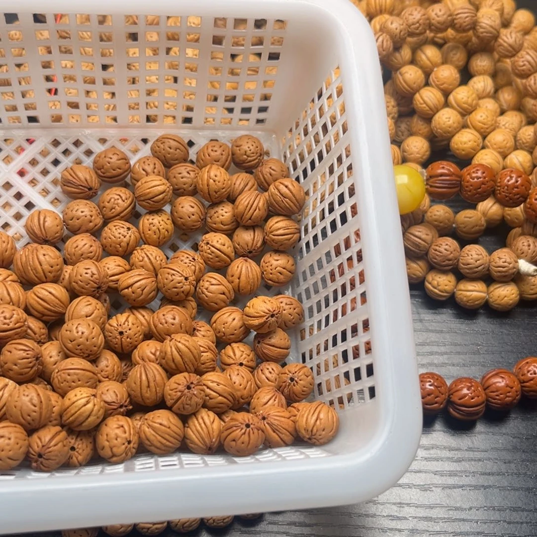 荷***莲吊坠文玩核桃野生小桃核必须玩红