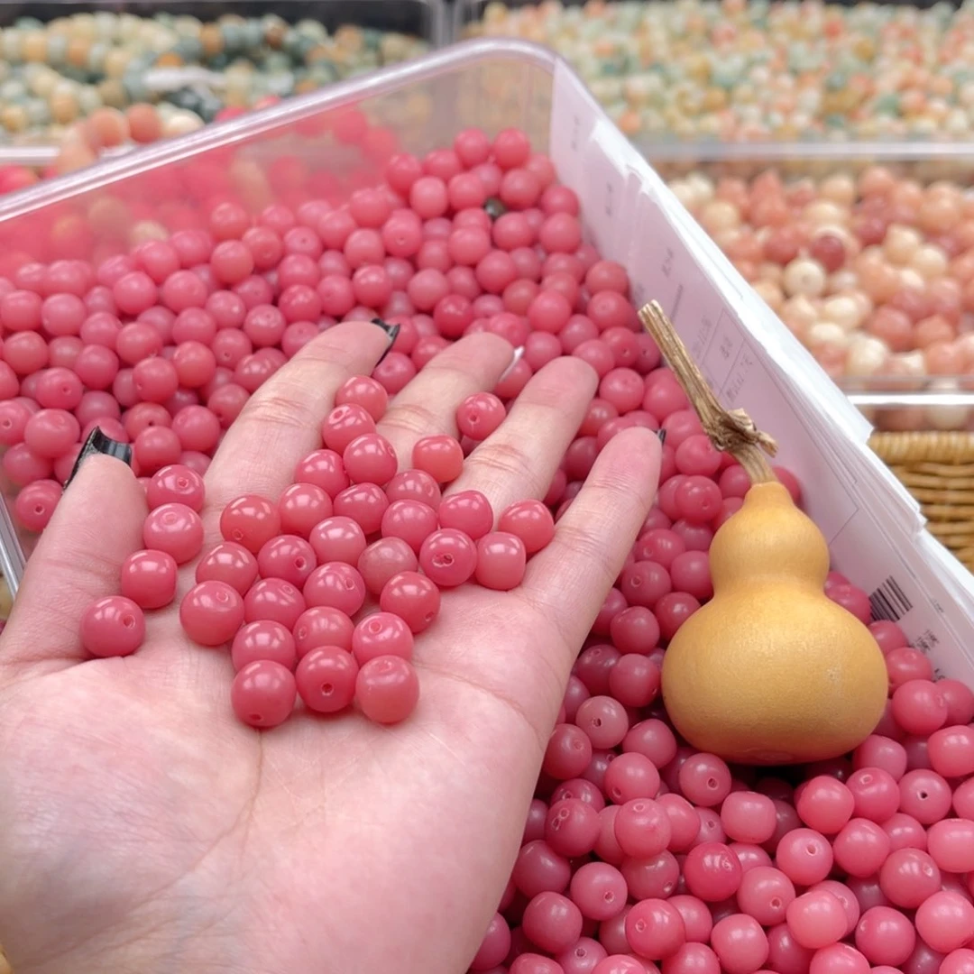 白玉菩提吊坠z10-11mm150颗。蜜桃粉+1葫芦