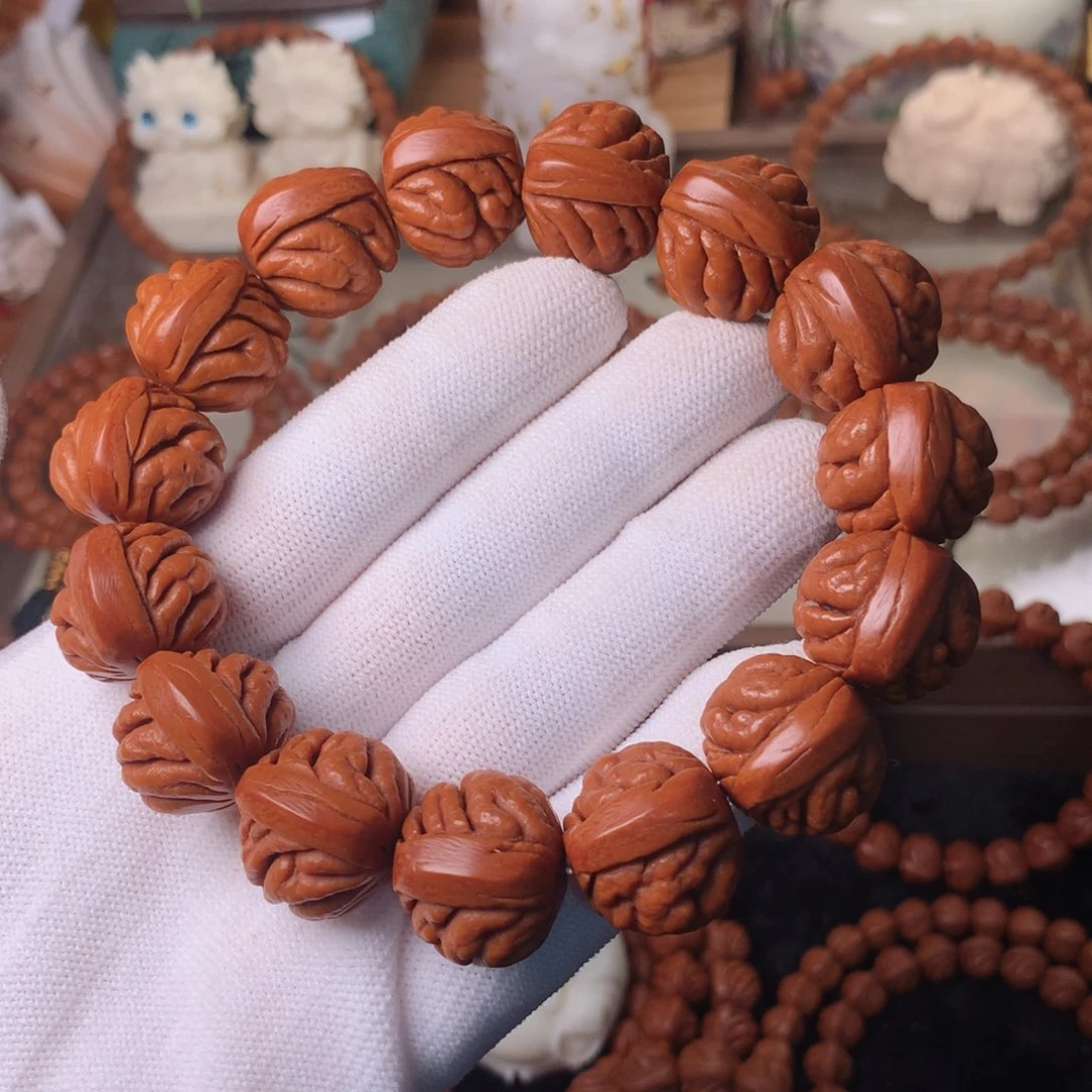 小***鑫吊坠桃核豹子头手串20