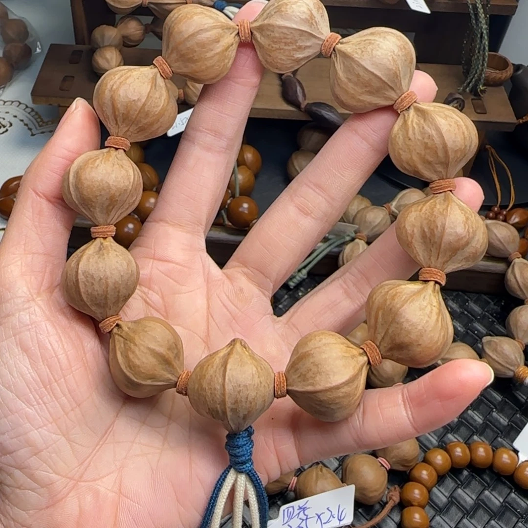 手串橄榄核01。2.35*2.4四花