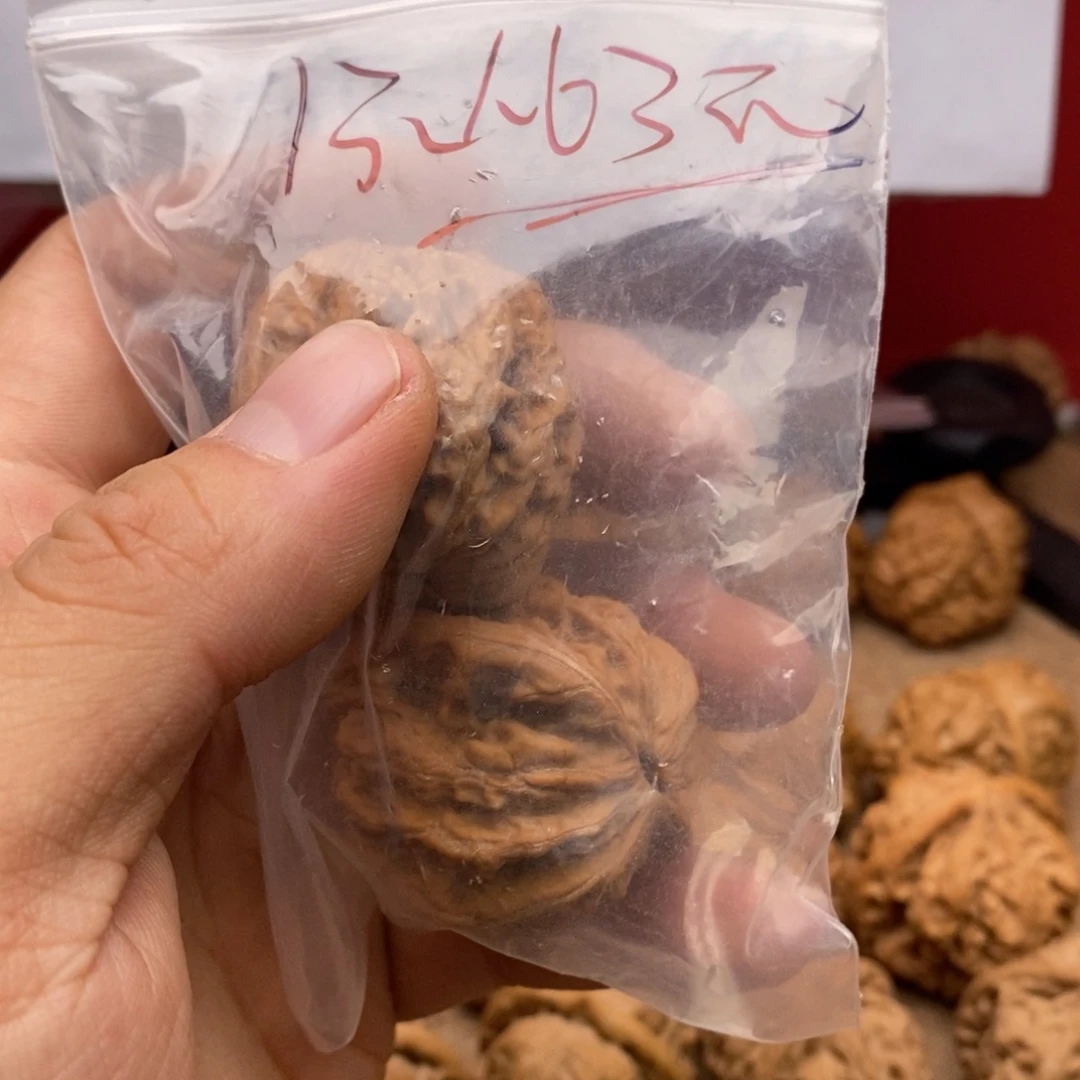 南***）桃核吊坠虎头文玩核桃手把件