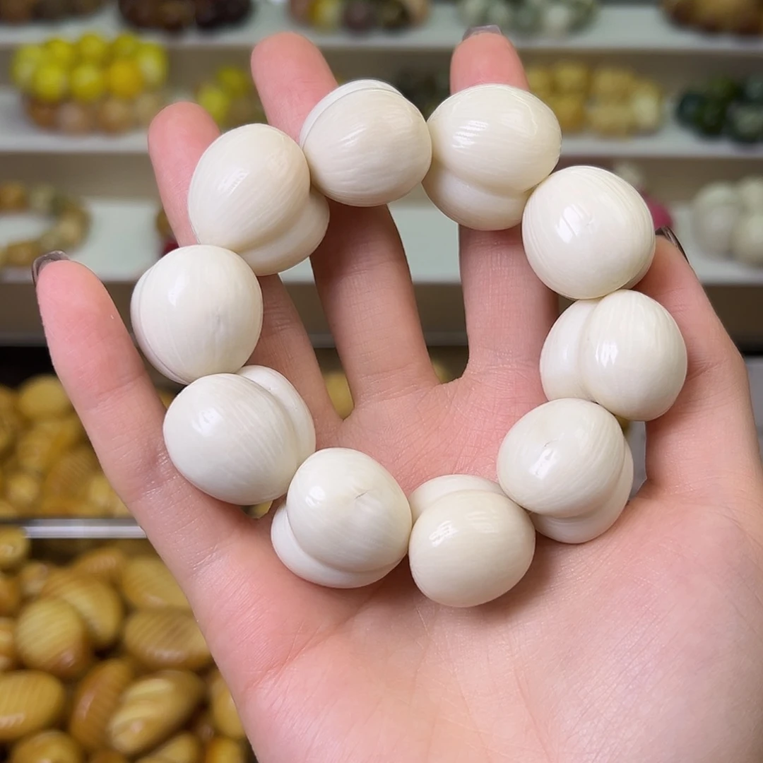 菩提根/象牙果吊坠瑕疵卡25拉丝屁桃一串