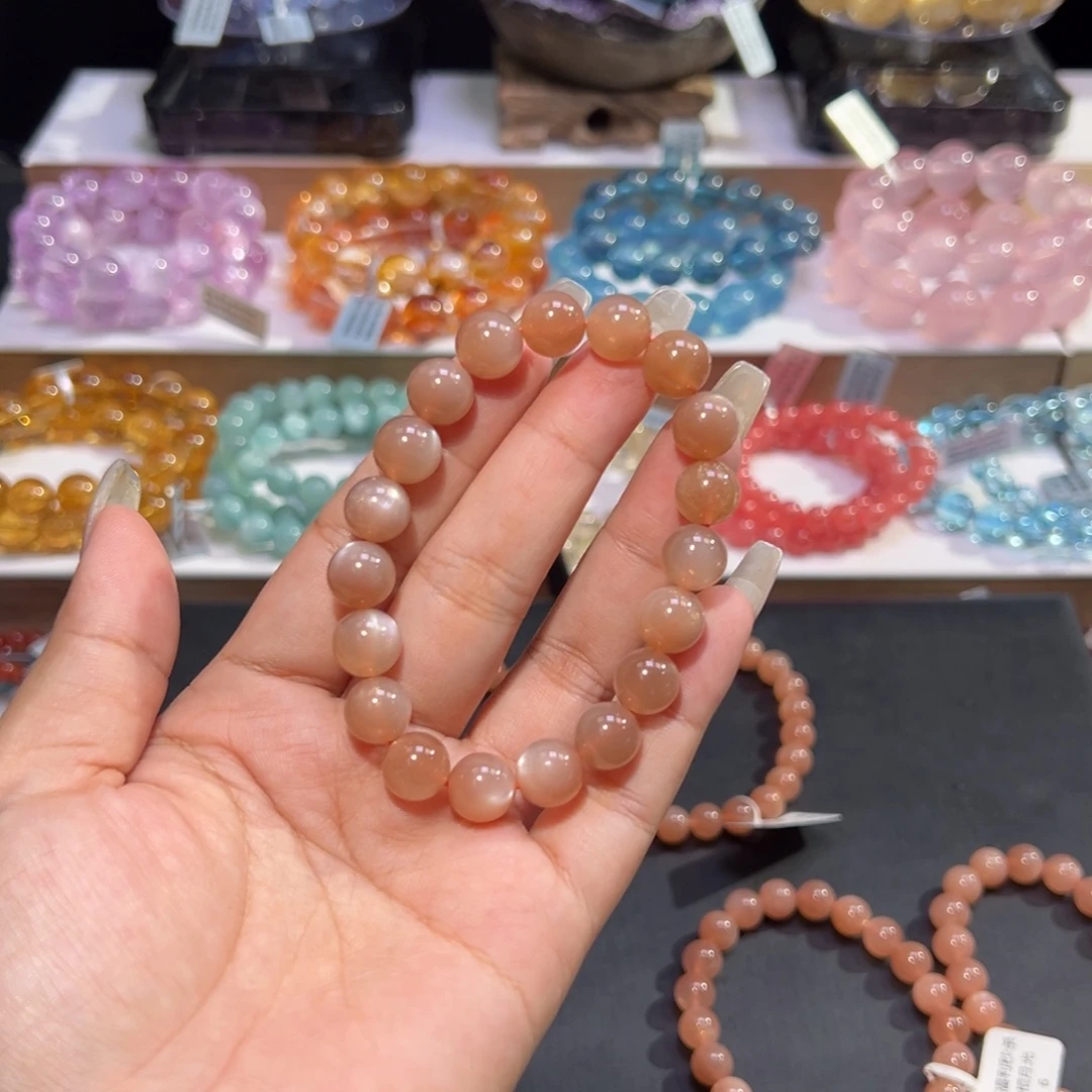 夺***猩未镶嵌手串水晶奶茶月光10mm