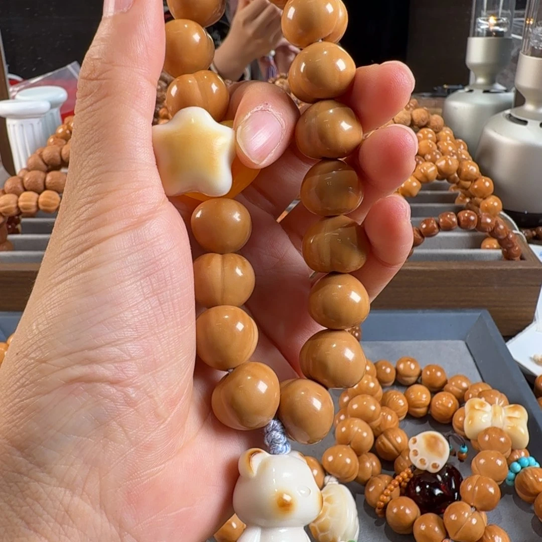 盈***盈猴头核桃吊坠光面屁桃换星星、流苏橘蓝小象下面的