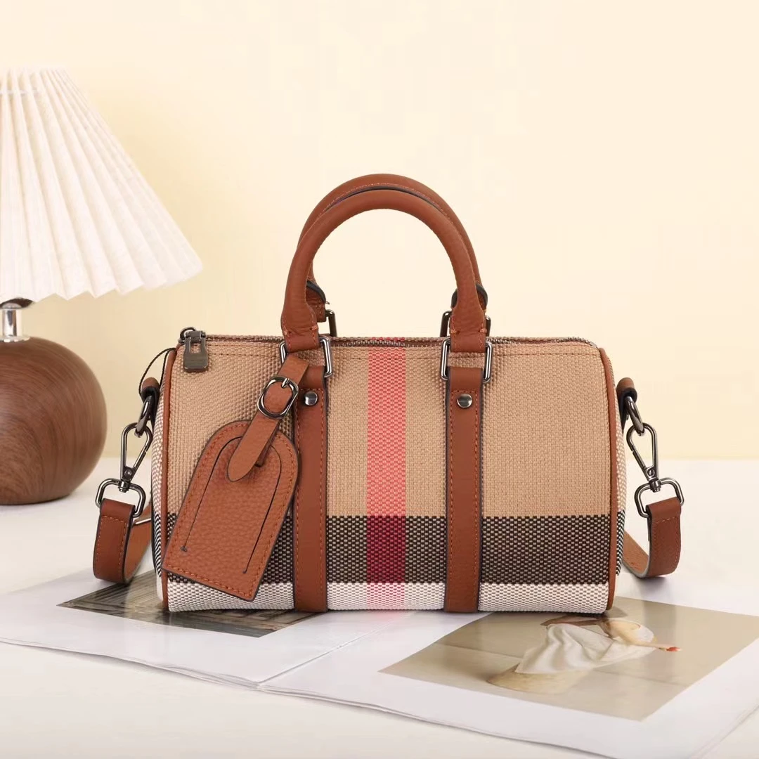 手提单肩斜挎精致枕头包能装格子包头层牛皮