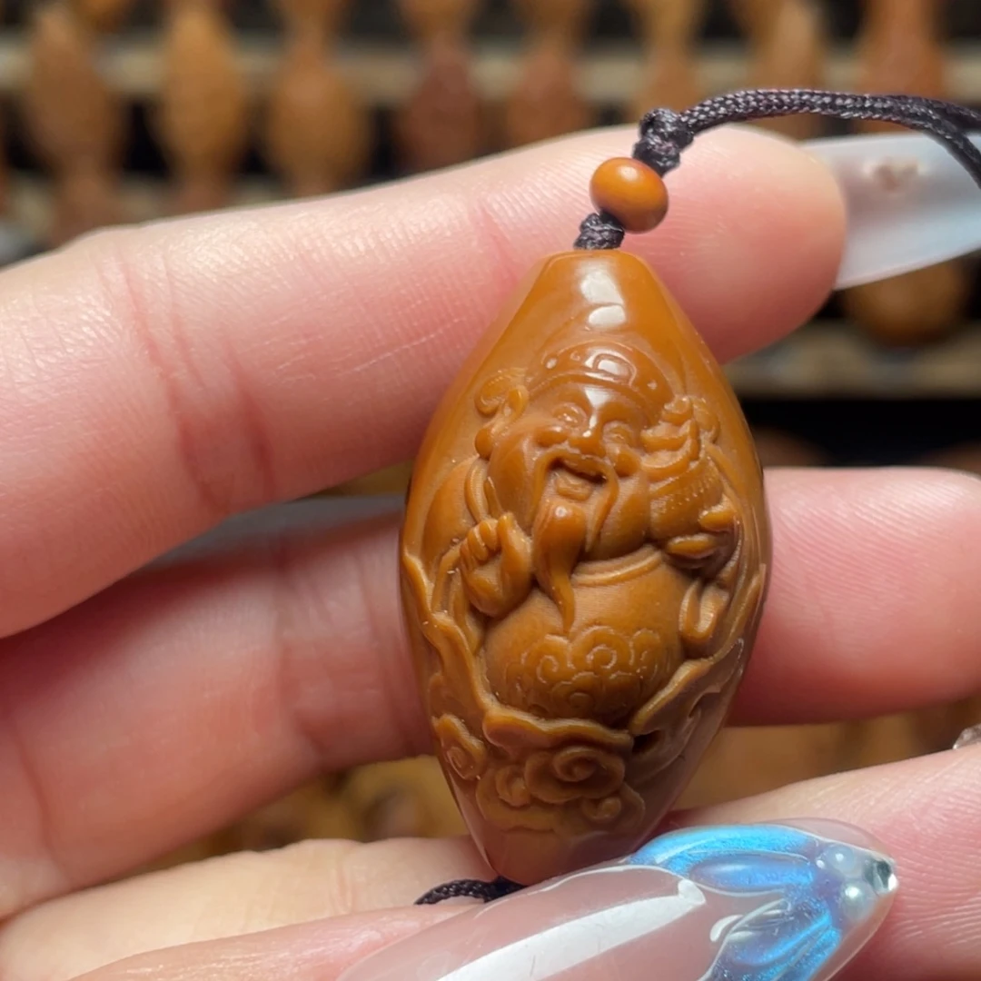 橄榄核把件包衣财神