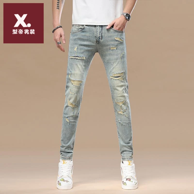 2025秋季新款高端破洞补丁九分牛仔裤男修身小脚潮流时尚弹力长裤