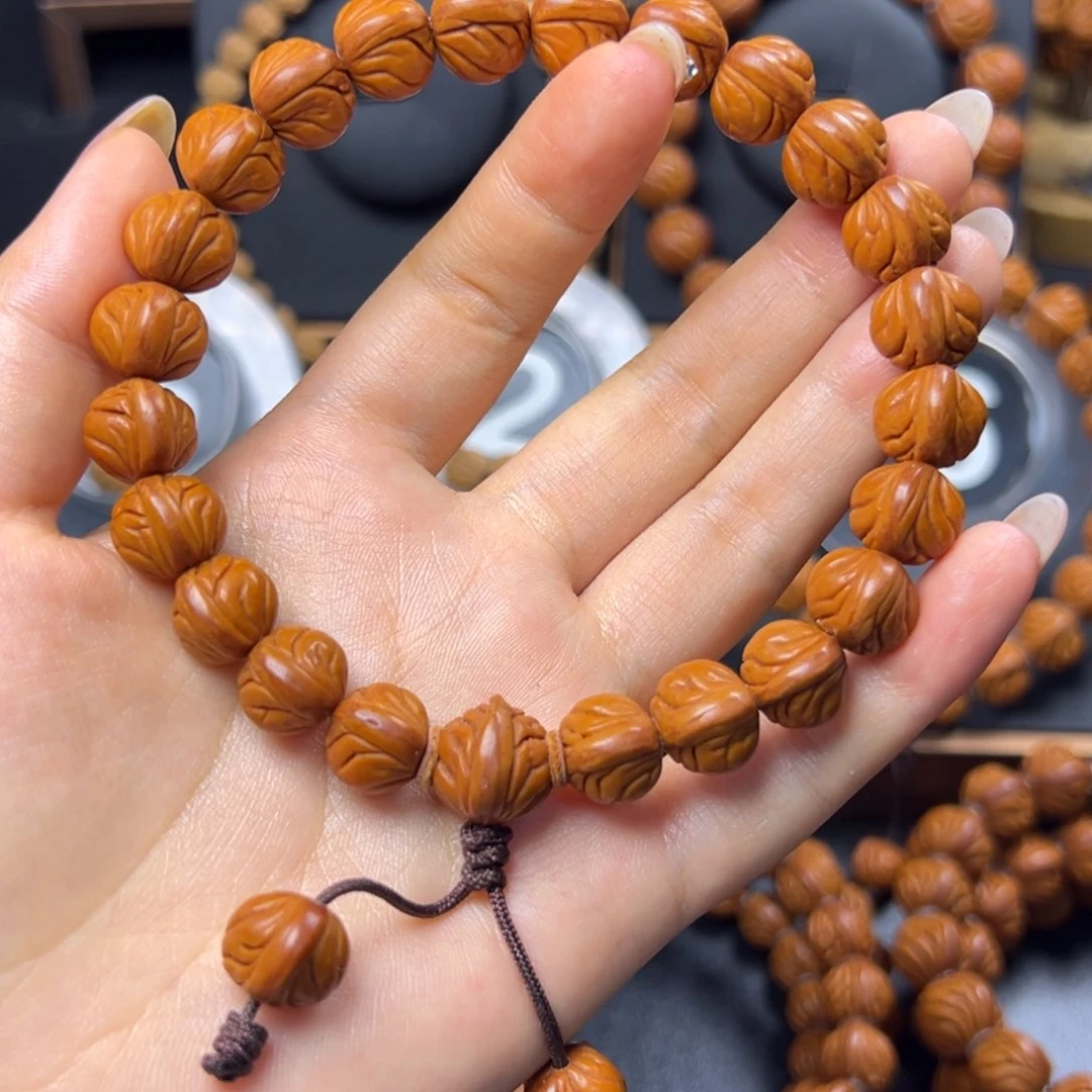 慧***缘桃核手串野生玉龙脊12