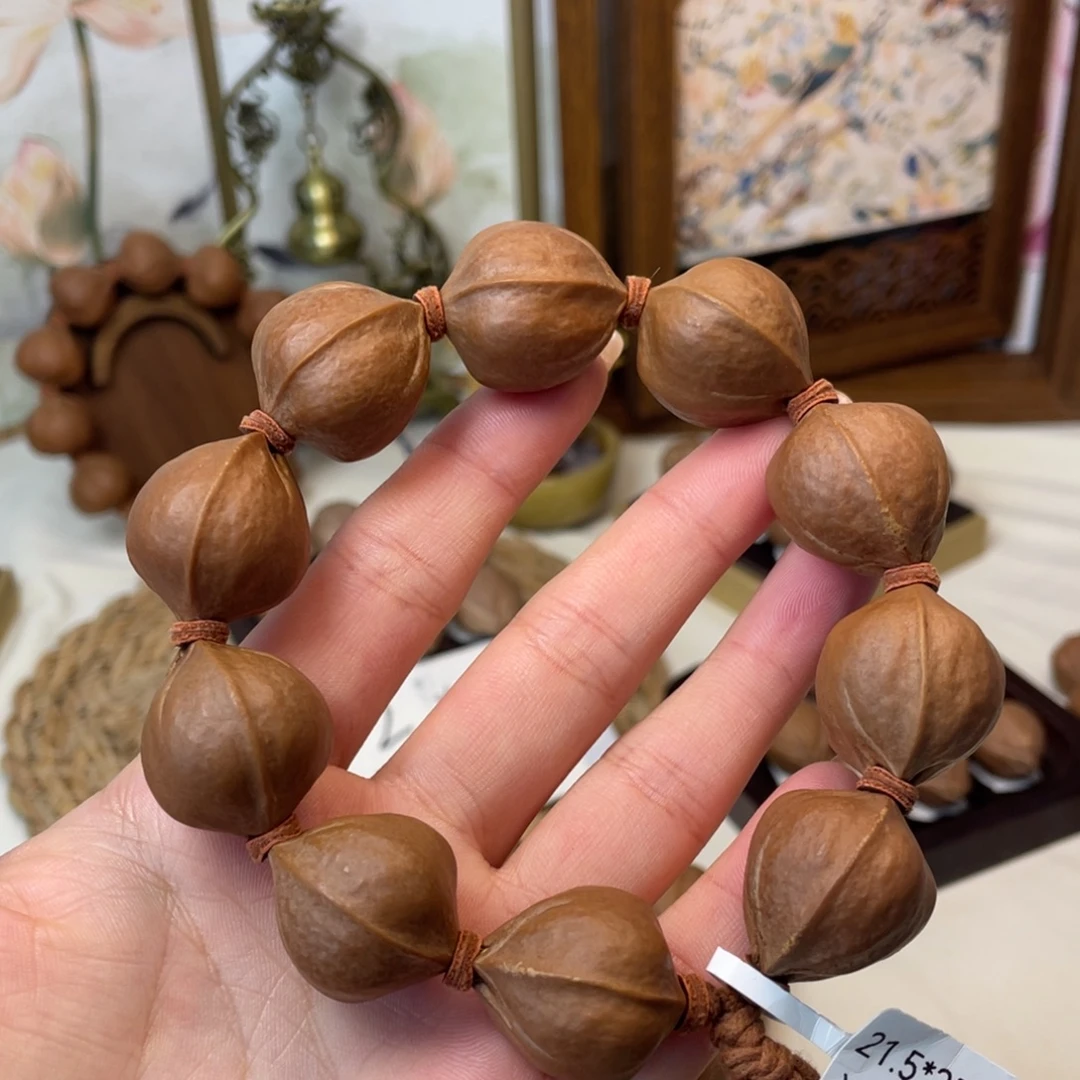 丁***二橄榄核手串/手链21.5*25梅林铁核