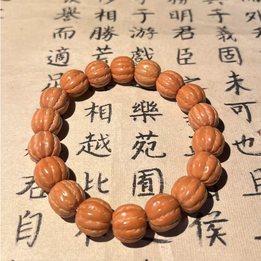 猴头核桃雕刻京巴棱手串微瑕