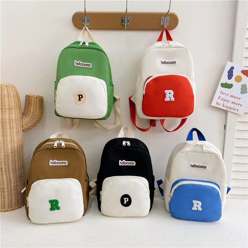 儿童包2023新款韩国字母撞色宝宝双肩包帅气男童出街造型背包书包