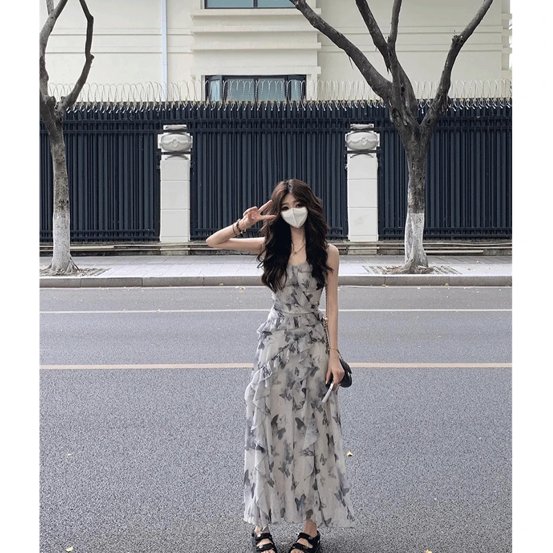 女夏季2024年法式蝴蝶印花木耳边吊带连衣裙新款气质不规则长裙子