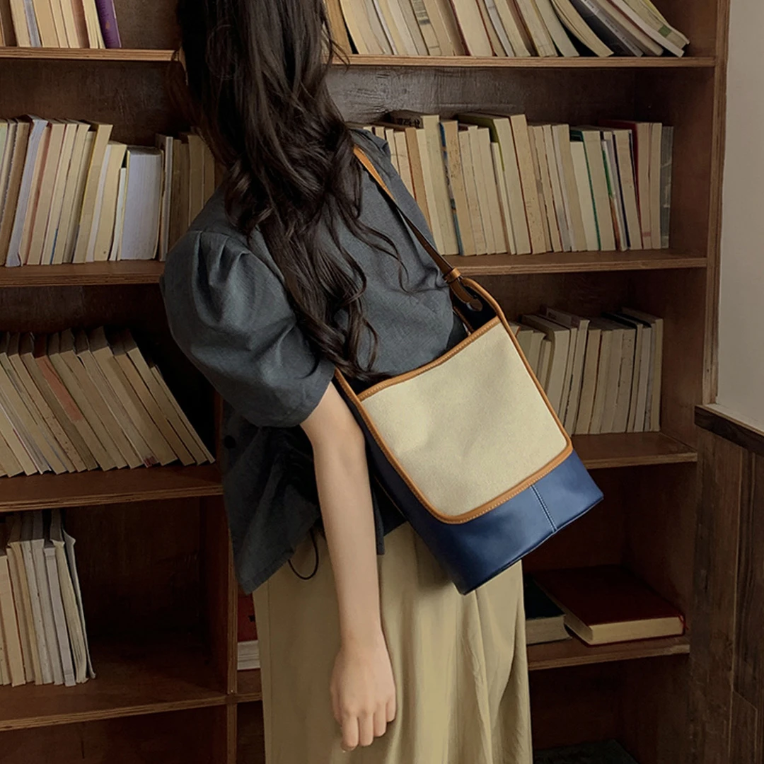 FOXER时尚潮流水桶包休闲百搭复古小众单肩撞色拼色肩包斜挎包