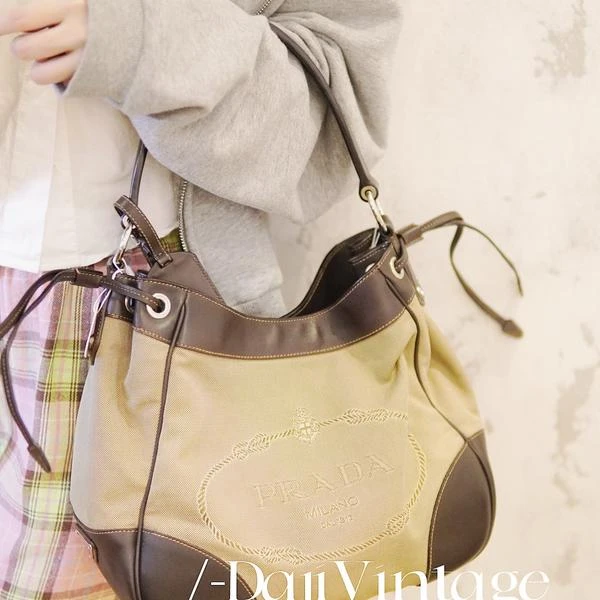 大吉中古/Prada普拉达帆布拼皮抽绳单肩包
