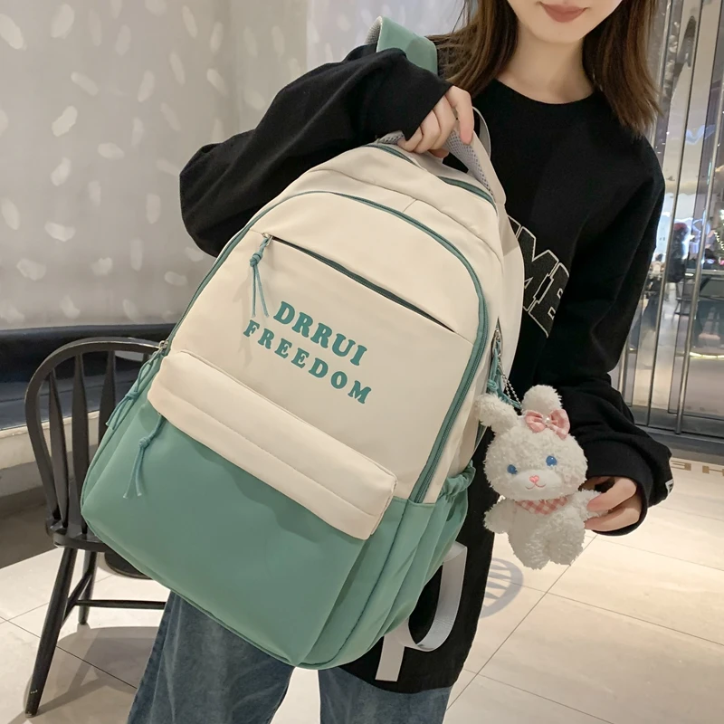 书包女初中生高中学生2023新款大容量字母少女小学生大学生双肩包