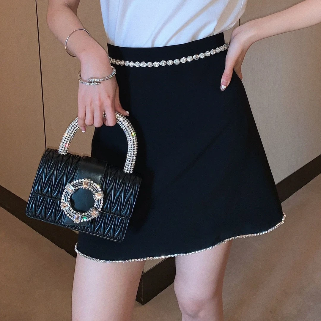 半身裙高端品质2025春夏新款钻条装饰A摆小黑裙高档链条洋气短裙
