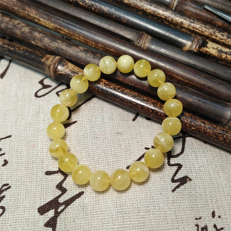 约9mm金绞白花蜜蜡圆珠单圈约9克