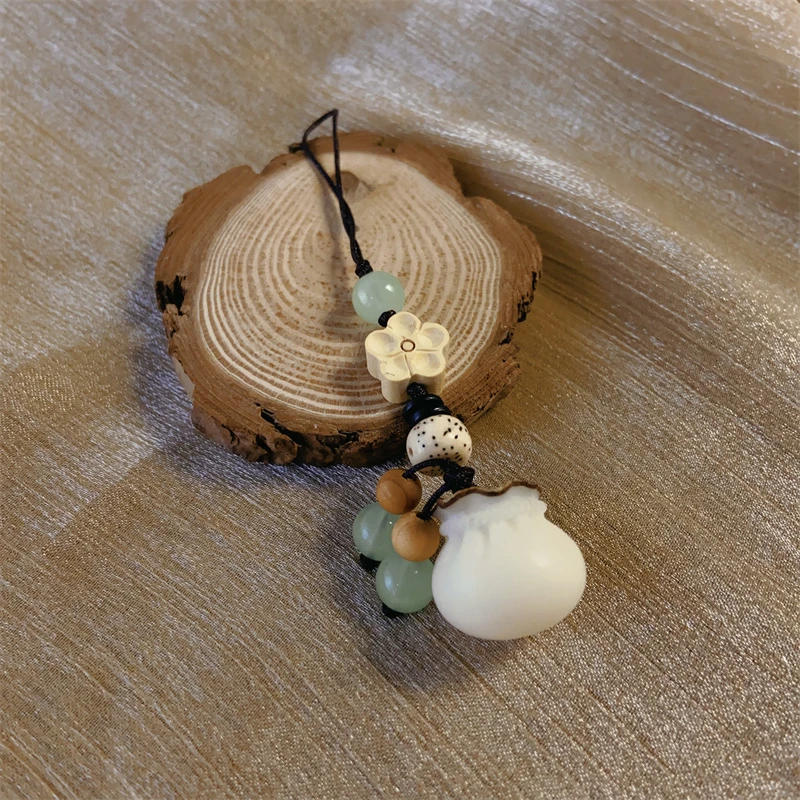 约19*19mm白菩提招财福袋手机包包挂