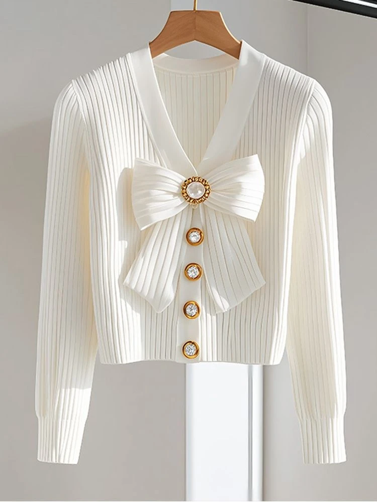 冷淡系独特别致超好看2025秋冬今年流行爆款蝴蝶结白色针织上衣女