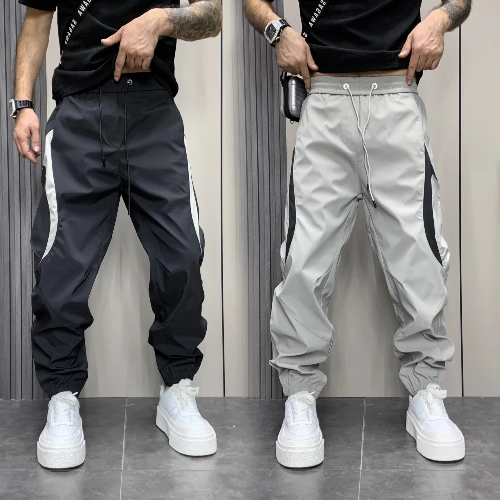 秋季拼色大口袋工装裤男生宽松束脚哈伦裤立体裁剪拼接弯刀休闲裤