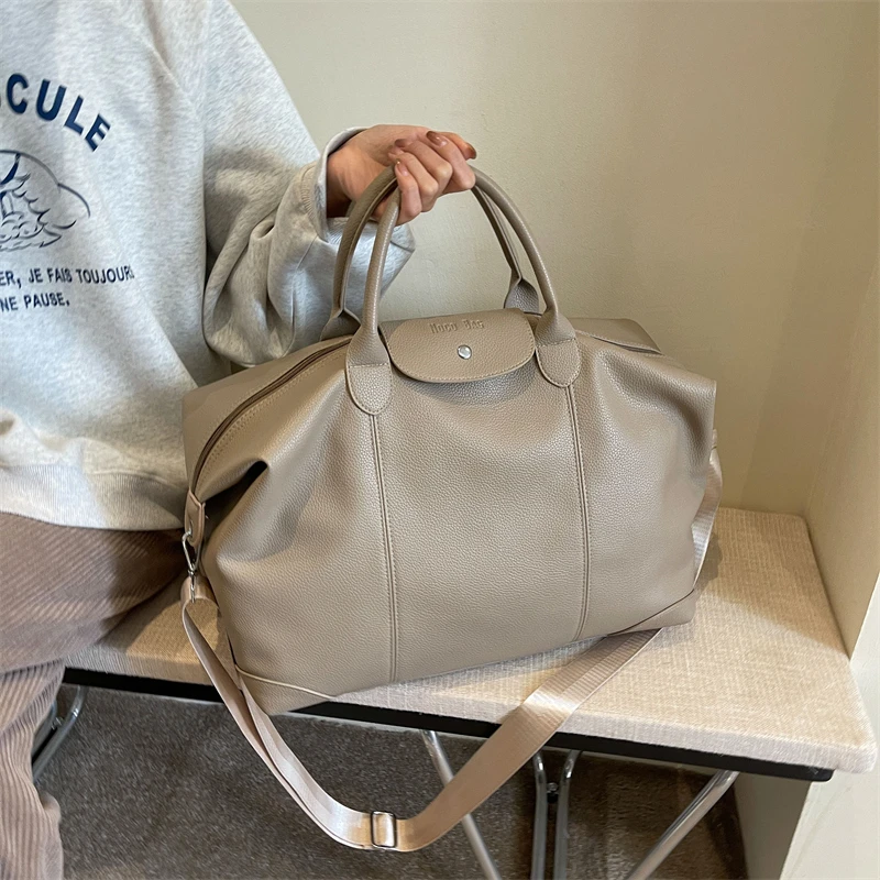 旅行包大容量出差登机收纳包轻便瑜伽健身包简约学生住宿行李包